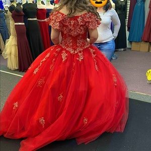 Red ball gown dress extra fluffed with gold patches, size extra small.
